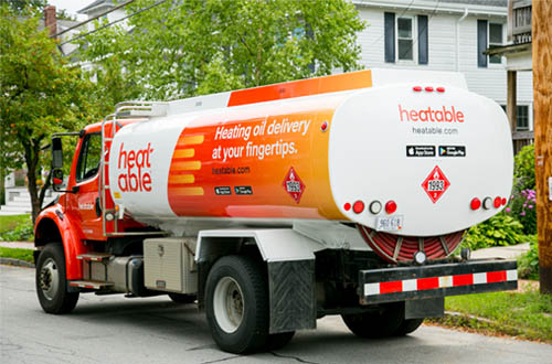 Heatable Oil Truck Delivering Oil to Customer in Maine